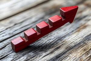 Red Wooden Arrow Staircase on Rustic Wood Background - Growth and Success Concept photo