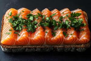 Gourmet Open-Faced Sandwich with Fresh Smoked Salmon and Herbs on Rustic Bread photo