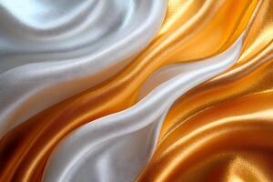 Luxurious Silk Fabric Waves in Gold and White for Elegant Design and Decor photo