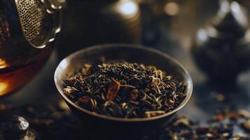 Aromatic loose leaf tea in rustic bowl with subtle background lighting photo