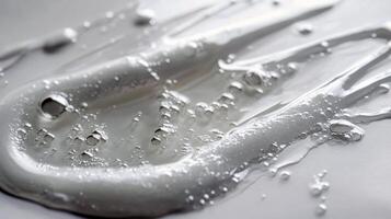 Close-up of clear gel texture with bubbles on a white background photo