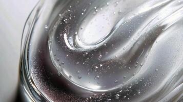 Close-up of clear gel texture with air bubbles on smooth surface photo