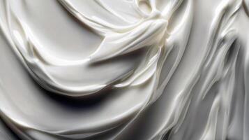 Close-up of smooth creamy texture swirls in white beige color photo
