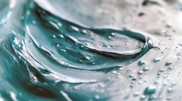 Close-up of textured blue gel with water droplets photo
