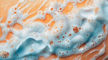 Close-up of soapy bubbles on smooth orange surface photo
