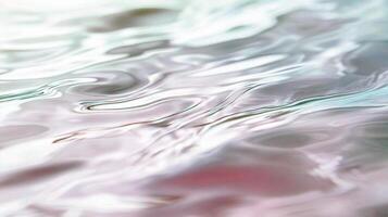 Pink rippled liquid texture with abstract fluid patterns and light reflections photo