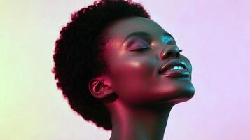 Serene african female with closed eyes in vibrant red and pink lighting photo