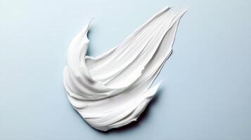Smooth creamy white texture on soft blue background photo