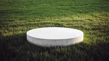 Concrete pedestal in lush green field minimalist outdoor design photo