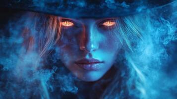 Mysterious female with glowing eyes amidst blue smoke photo