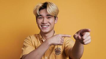 A young man is pointing at something photo
