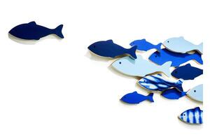 Abstract Composition of Blue Fish Shapes on White Background Illustrating Movement and Contrast in Minimalist Design photo