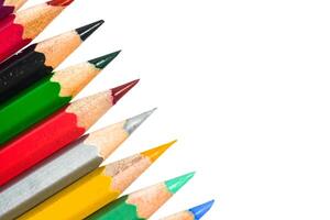 Colorful Assortment of Sharpened Pencils Arranged on White Background for Creative and Educational Concepts photo