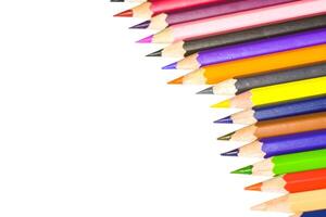 Colorful Assortment of Sharpened Colored Pencils Arranged in a Diagonal Pattern on a White Background photo