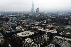 Views of London skyline showing the Shard and River Thames on a foggy photo