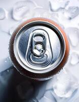 Top view of a soft drink can with ice vapor on it on white background photo