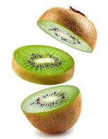 A ripe kiwifruit sliced and floats in the air isolated on white background. photo