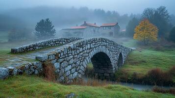 A stone bridge over a stream photo