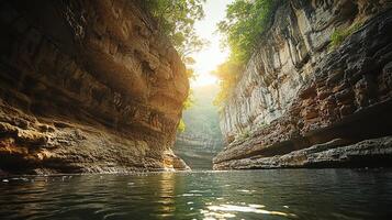 A river flowing through a canyon with trees and water photo