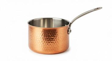 A copper kettle with a handle on a white background photo