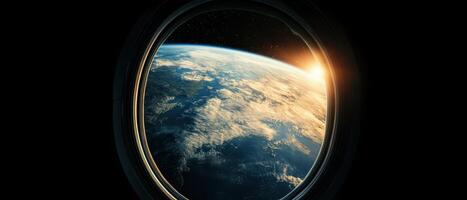 A breathtaking view of Earth from a spacecraft window, showcasing the planet's curvature and the sun rising on the horizon. photo