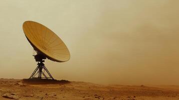 Satellite dish in a dusty, desolate landscape under a hazy sky, suggesting a remote and isolated environment. photo