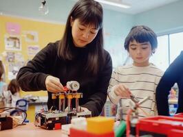 A woman and a child engage in hands-on robotics activities in a colorful classroom, fostering learning through creativity and collaboration. photo