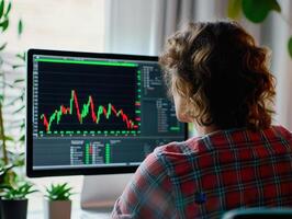 ESG Investing Trends Concept. A person analyzing stock market data on a computer screen surrounded by indoor plants. photo