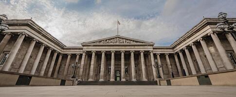 British Museum neoclassical facade stands tall with iconic columns and a balanced design, symbolizing its rich history. photo