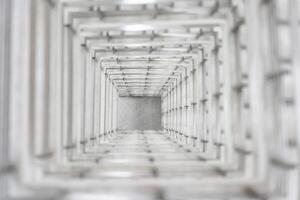 Top angle view of the white reinforced steel bar fram ework column construction in the work site. photo