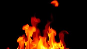 Dynamic and Engaging Flames Dancing Against a Dark Background photo
