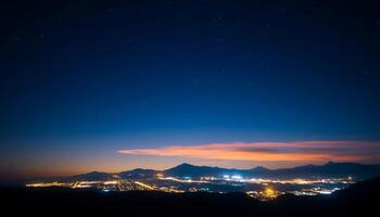 Stunning Night Sky Over a City with Distant Mountains and Colorful Clouds photo