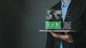 man use software to save energy,and reduce global warming,ecology friendly investment,ESG environment social governance,nature green Business Innovation and Sustainable Development concept photo