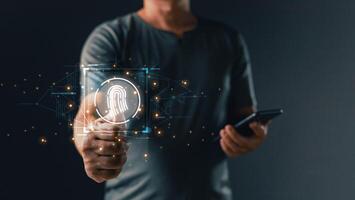 Businessman scan personal data on finger print with virtual screen interfaces. Cyber security and privacy concepts to protect data. Lock icon and internet network security technology. photo