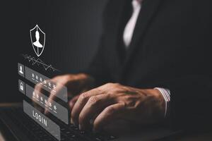 Businessman protecting personal data on laptop with virtual screen interfaces. Cyber security and privacy concepts to protect data. Lock icon and internet network security technology. photo