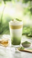Refreshing iced matcha latte with cream and matcha powder for summer enjoyment photo
