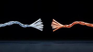 Close-up of twisted electrical wires in contrasting colors against a dark background photo