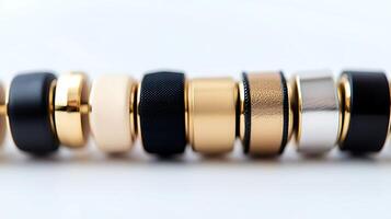 Close-up of stylish rings arranged in a line showcasing various textures and colors photo