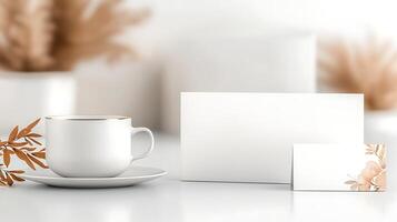 Elegant white cup and saucer on a minimalistic table with blank cards and soft background elements photo