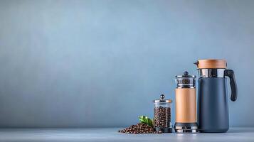 Stylish coffee setup featuring a French press, coffee beans, and a thermos on a minimalist background photo