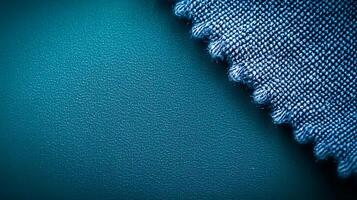 Close-up of textured fabric edge against a smooth surface, showcasing color contrast and detail photo