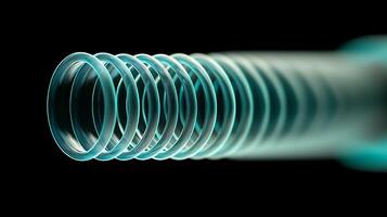 Close-up view of a spiral spring against a dark background showcasing its curvature and depth photo