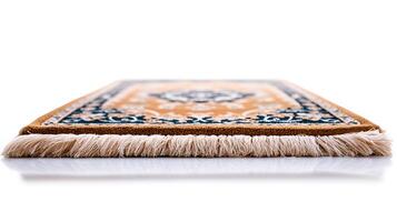 Close-up view of a beautifully patterned rug with intricate designs and soft fringes photo
