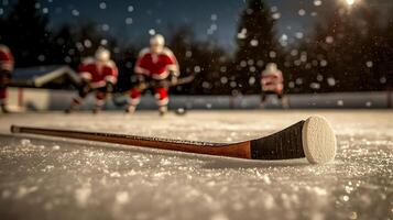 Ice hockey players practice on a snowy rink at dusk, showcasing teamwork and skill in action photo