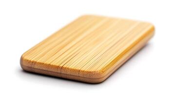 Smooth bamboo rectangular object with subtle grain patterns on a white background, ideal for eco-friendly designs photo