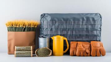 Arrangement of gardening tools and supplies including gloves, seeds, and a watering can on a table photo