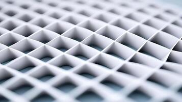 Close-up view of a textured white grid pattern showcasing geometric shapes and depth photo
