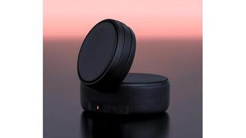 Sleek black audio device with a lid open, set against a soft gradient background photo