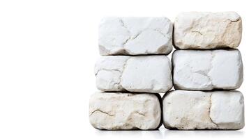 Stacked white stones arranged neatly on a clean surface, highlighting their texture and color photo