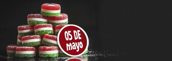 stack of red, white and green candy on top of each other with the words 05 DE mayo written in bold letters next to it, black background, red round sticker shape with rounded edges photo